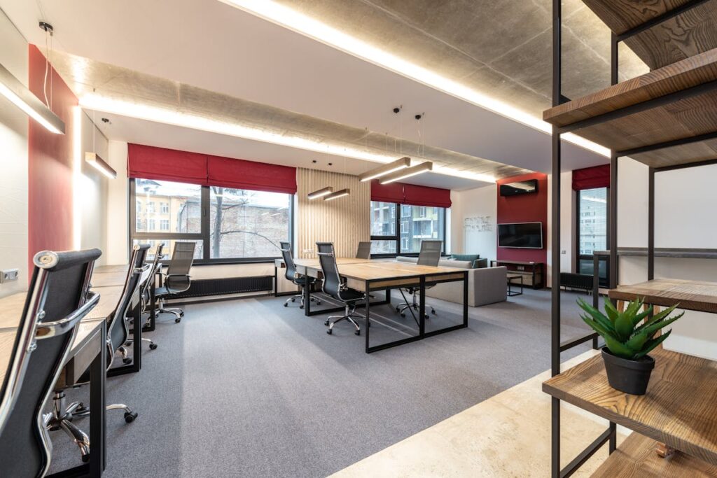 Office with tables and chairs near windows